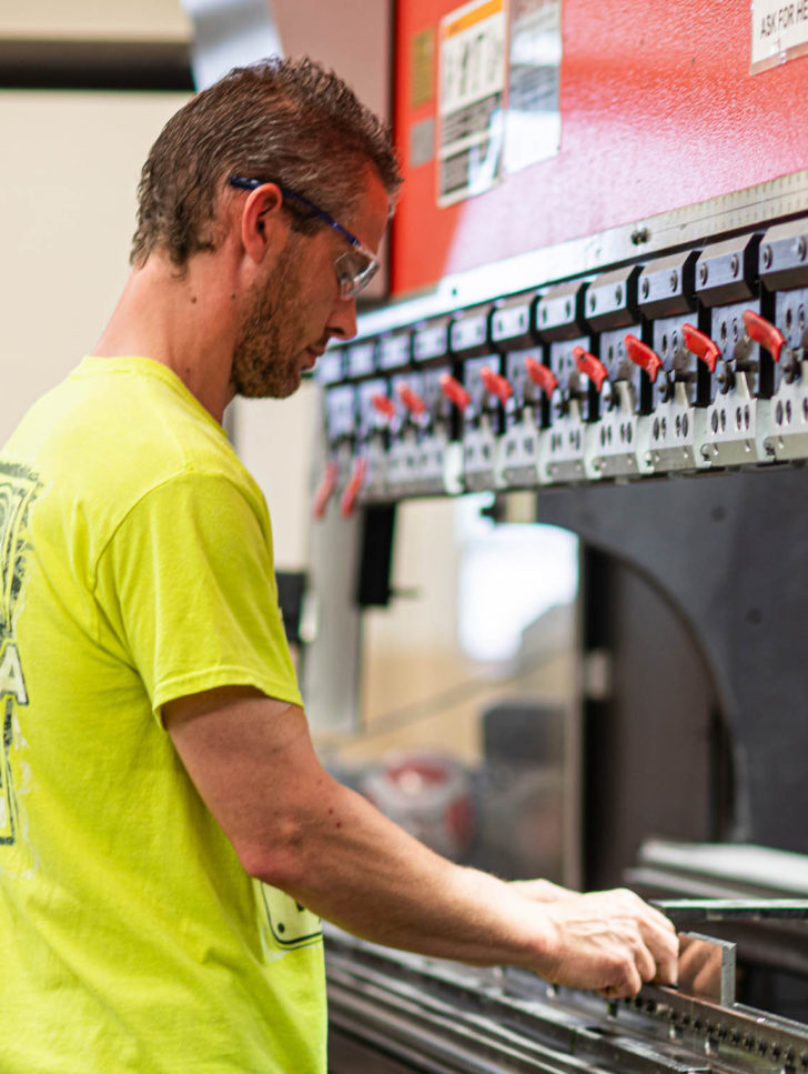 Brake manufacturing Dawson employee setting up a brake